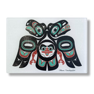 Beautiful glass cutting board featuring the Lovebirds Native formline design created by Tlingit Master Artist Israel Shotridge
